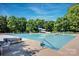 Large community pool with a slide and plenty of space for recreation and relaxation on a sunny day at 15430 Waterfront Dr, Huntersville, NC 28078