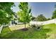 Spacious backyard perfect for entertaining, with a patio, seating, fire pit, and white picket fence at 1553 Arcadia Bluff Dr, York, SC 29745