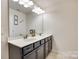 Bathroom featuring a double sink vanity with a white countertop and black cabinets at 1553 Arcadia Bluff Dr, York, SC 29745