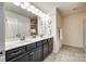 Bright bathroom featuring a double sink vanity with a white countertop and shower at 1553 Arcadia Bluff Dr, York, SC 29745