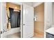Bathroom showcasing a shower with a patterned curtain and an open doorway at 1553 Arcadia Bluff Dr, York, SC 29745