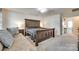 Bedroom features carpeted floors, a large bed, and seating area near the windows at 1553 Arcadia Bluff Dr, York, SC 29745