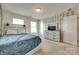 Cozy bedroom with light carpet, large bed, vine wallpaper, and natural light at 1553 Arcadia Bluff Dr, York, SC 29745
