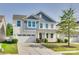 Charming two-story home with a two-car garage, inviting front porch, and well-maintained landscaping at 1553 Arcadia Bluff Dr, York, SC 29745