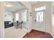 Bright foyer featuring hardwood floors, a stylish front door, and a cozy sitting room with a sofa at 1553 Arcadia Bluff Dr, York, SC 29745