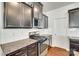 Modern kitchen features stainless steel appliances, granite counters, subway tile, and dark wood cabinets at 1553 Arcadia Bluff Dr, York, SC 29745