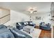 Cozy living room with hardwood floors, ceiling fan, fireplace, and comfortable blue sofas at 1553 Arcadia Bluff Dr, York, SC 29745