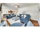 Stylish living room featuring hardwood floors, a ceiling fan, and comfortable blue sofas at 1553 Arcadia Bluff Dr, York, SC 29745
