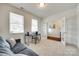 Bright office space with a sofa, desk, and ample natural light through the windows and french doors at 1553 Arcadia Bluff Dr, York, SC 29745