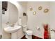 A half bathroom/powder room with modern fixtures, wood floors, and decorative gold mirrors at 1553 Arcadia Bluff Dr, York, SC 29745