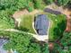 Stunning aerial view of home featuring meticulous landscaping, stone pathway, and elegant roof design at 167 Greenbay Rd, Mooresville, NC 28117