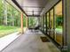 Inviting covered patio features comfortable seating and seamless indoor-outdoor living with sliding glass doors at 167 Greenbay Rd, Mooresville, NC 28117