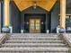 Inviting front porch with brick steps, stylish double doors, and lovely potted plants at 167 Greenbay Rd, Mooresville, NC 28117