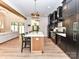 Bright open concept kitchen features stone countertops, seating at the island and stainless steel appliances at 167 Greenbay Rd, Mooresville, NC 28117