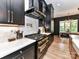 Modern kitchen features black appliances, a tile backsplash, and a gas range at 167 Greenbay Rd, Mooresville, NC 28117