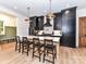Modern kitchen island features stone countertops, pendant lighting, and seating at 167 Greenbay Rd, Mooresville, NC 28117
