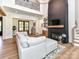 Bright living room features a grand fireplace, hardwood floors and an open concept design at 167 Greenbay Rd, Mooresville, NC 28117