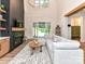 Bright living room boasts a fireplace, access to the backyard, and modern decor, great for relaxation and entertainment at 167 Greenbay Rd, Mooresville, NC 28117