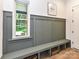 Mudroom featuring built-in bench, storage, and natural light, perfect for organization at 167 Greenbay Rd, Mooresville, NC 28117