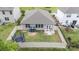 Aerial view of backyard featuring a trampoline, patio seating, and storage shed perfect for outdoor living at 1813 Shelbourne Way, Fort Mill, SC 29707