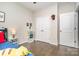 Charming bedroom with closet, decorative shelving, and hardwood floors for a cozy and inviting space at 1813 Shelbourne Way, Fort Mill, SC 29707