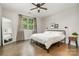 Bright bedroom with hardwood floors, ceiling fan, large windows, and neutral decor at 1813 Shelbourne Way, Fort Mill, SC 29707