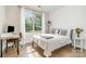 Sunny bedroom with large windows and workspace, filled with natural light at 1813 Shelbourne Way, Fort Mill, SC 29707