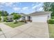 Single-story home with a two-car garage, and well-maintained lawn on a sunny day at 1813 Shelbourne Way, Fort Mill, SC 29707