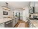 Kitchen with stainless steel appliances, granite counters and cabinetry, and center island at 1813 Shelbourne Way, Fort Mill, SC 29707