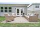 Cozy outdoor patio with stylish seating, perfect for relaxing and entertaining al fresco in backyard at 1813 Shelbourne Way, Fort Mill, SC 29707