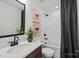 Modern bathroom features a tub with dark fixtures, and neutral tones throughout at 2004 Waxhaw Crossing Dr, Waxhaw, NC 28173