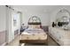 This bedroom features a large window, and a light color scheme at 2004 Waxhaw Crossing Dr, Waxhaw, NC 28173