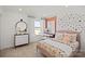 This bedroom features a pink color scheme, plenty of natural light, and modern decor at 2004 Waxhaw Crossing Dr, Waxhaw, NC 28173