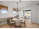 Cozy dining area with a modern chandelier and abundant natural light at 2004 Waxhaw Crossing Dr, Waxhaw, NC 28173