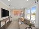 The living room features neutral colors, a comfortable couch, and a large window at 2004 Waxhaw Crossing Dr, Waxhaw, NC 28173