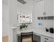 Charming office nook with a built-in desk, bright lighting, and views into the kitchen at 2004 Waxhaw Crossing Dr, Waxhaw, NC 28173