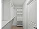 This walk-in closet has built-in shelving and drawers at 2004 Waxhaw Crossing Dr, Waxhaw, NC 28173