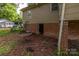 Exterior view of the home's backyard, foundation and yard at 208 N School St, Mount Gilead, NC 27306