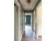 Hallway showcasing aged paint and hardwood floors, offering a glimpse into a home renovation project at 208 N School St, Mount Gilead, NC 27306