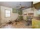 Outdated kitchen needing renovation, featuring green cabinets and a double sink, presents a remodeling opportunity at 208 N School St, Mount Gilead, NC 27306