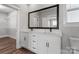 Bright bathroom boasts double sinks, white cabinets, black hardware, and a walk-in closet at 2092 Fordhill St, Rock Hill, SC 29732