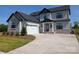 Charming two-story home featuring a two-car garage and a well-manicured front yard at 2092 Fordhill St, Rock Hill, SC 29732
