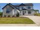 Beautiful two-story home with stone and siding, complemented by a lush green lawn at 2092 Fordhill St, Rock Hill, SC 29732