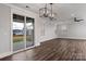 Spacious living room featuring an outdoor view through sliding glass doors and modern ceiling fans at 2092 Fordhill St, Rock Hill, SC 29732