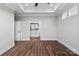 A main bedroom has a tray ceiling, ceiling fan, and adjoins to the ensuite bath with double sink at 2092 Fordhill St, Rock Hill, SC 29732