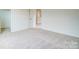 Neutral carpeted bedroom featuring a hallway entrance and views to a walk-in closet at 2233 Tabor Rd # 586, Sherrills Ford, NC 28673