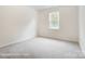 Cozy bedroom features plush carpeting and a bright window with a pleasant view of the outdoors at 2233 Tabor Rd # 586, Sherrills Ford, NC 28673