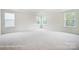 Large bedroom with bright windows, plush carpet, and an airy, open feel at 2233 Tabor Rd # 586, Sherrills Ford, NC 28673