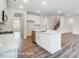 Open kitchen with white cabinetry, stainless steel appliances, and an island with a sink at 2233 Tabor Rd # 586, Sherrills Ford, NC 28673