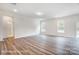 Open living room with gray wood floors, lots of natural light, and an open doorway to a bathroom at 2233 Tabor Rd # 586, Sherrills Ford, NC 28673